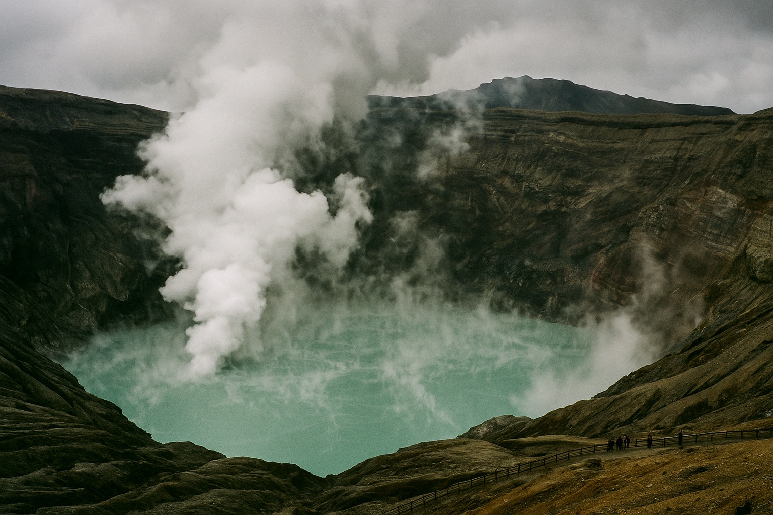 The steaming turquoise crater lake of Nakadake at Mount Aso