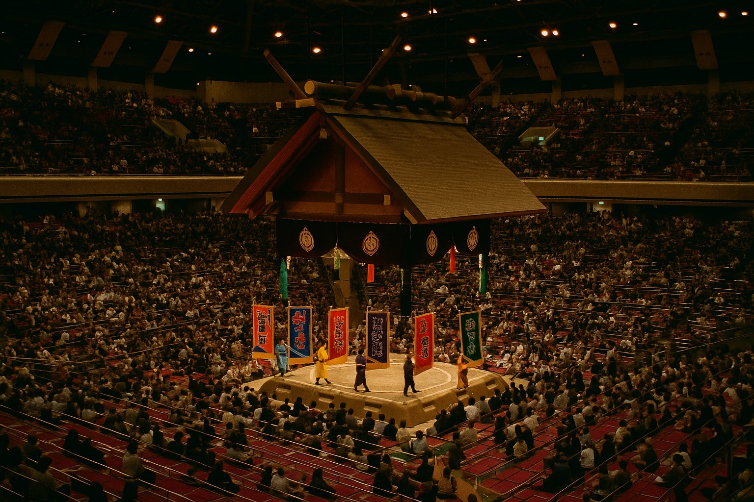 Inside the sumo arena in Fukuoka with the dohyo ring under its suspended roof